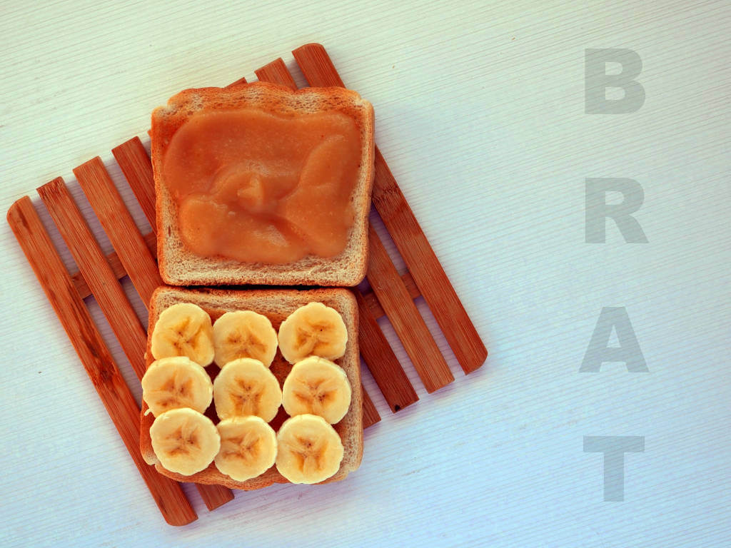 BRAT diet recipes -Two toasts, banana slices, and applesauce