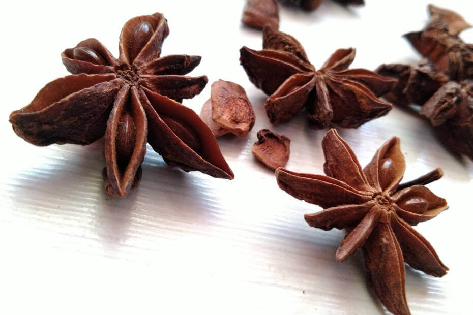 Dry star anise stars on a white table